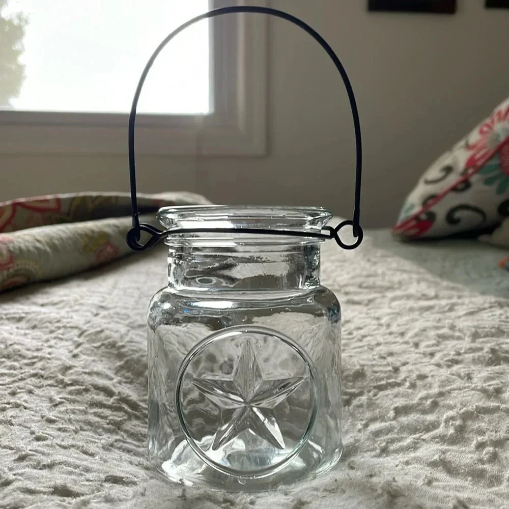 Clear Glass Jar 3D Star on Front. Black Metal Handle. Patio decor. Candle holder